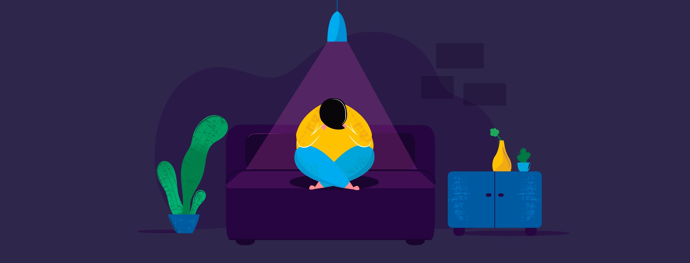 Person sitting alone in the dark.