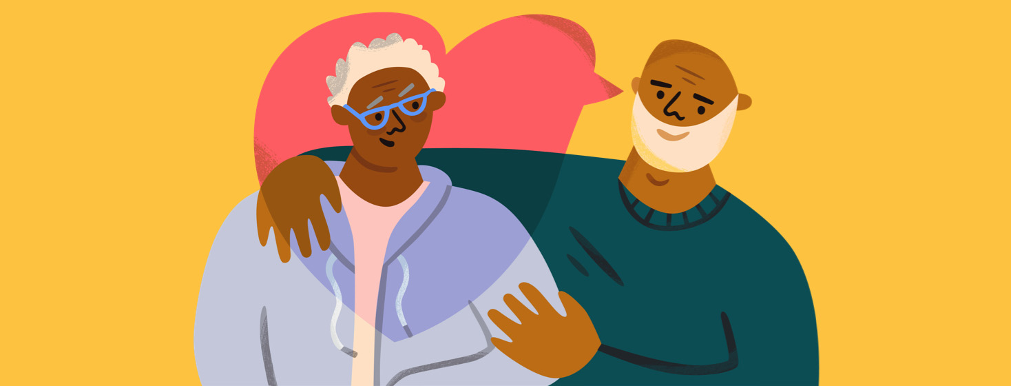 Older man embracing a loved one in support