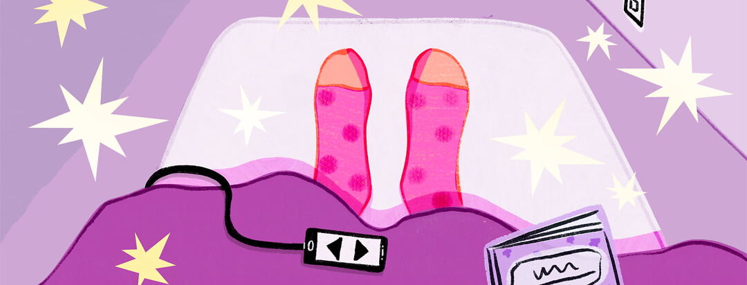 Stars float around sock covered feet sticking out from under the covers on an adjustable bed